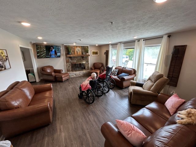 Resident relaxing in the spacious and comfortable living room of Lighthouse PCH.