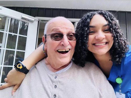 Smiling caregiver with happy senior resident at Lighthouse Personal Care Homes in Dalton, Georgia